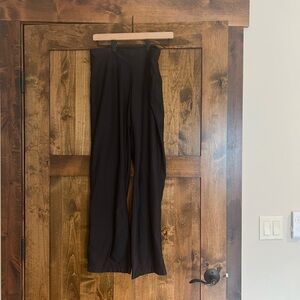 Woman's Lucy Activewear, black, flare pants. Size small. Elastic waist /pocket.